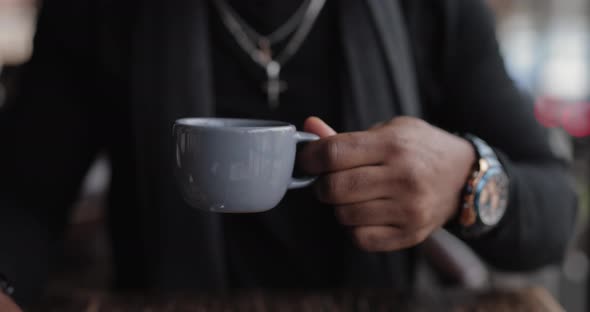 African American Man Drinking Tea Sitting in a Cafe Slow Motion