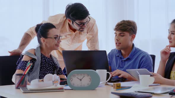 Group Meeting of Creative Business People Designer and Artist at Office Desk