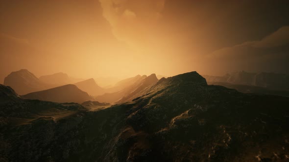 High Mountain Peaks Covered with Dramatic Heavy Fog alt