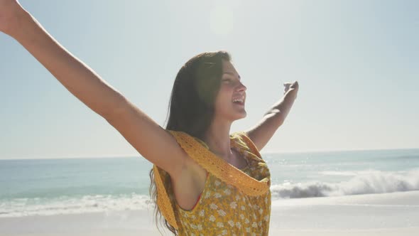 Caucasian woman enjoying the fresh air at beach