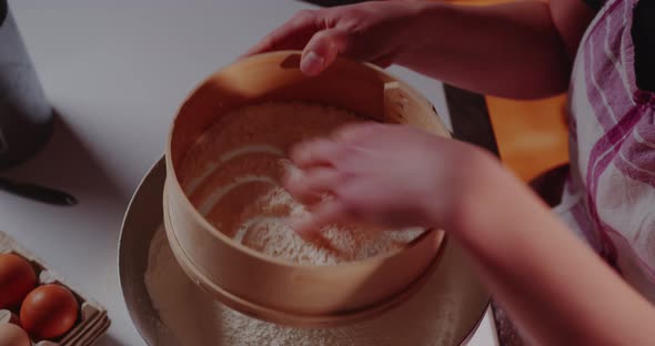 Sifting Flour in Strainer