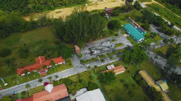 Cinematic Drone Footage of Palm Oil Mill Effluent residential consists of buildings, homes, main roa