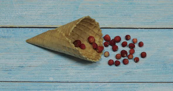 Berry Ice Cream. Berries of Strawberry in a Waffle on a Blue Wooden Background