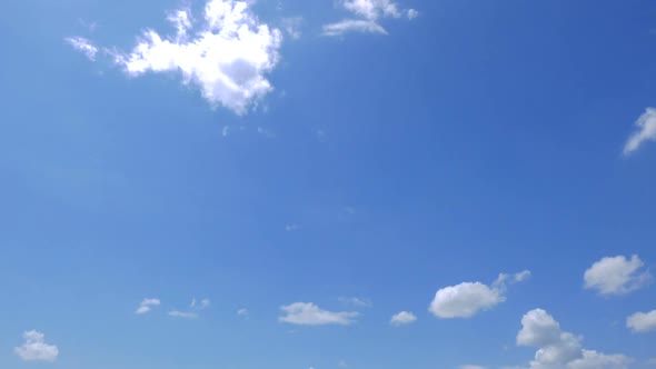 Time lapse of white cloud moving pass around sky background