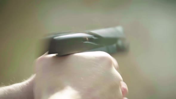 Close-up Shot of a Pistol. Slow Motion.