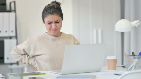 Indian Woman Having Back Pain at Work