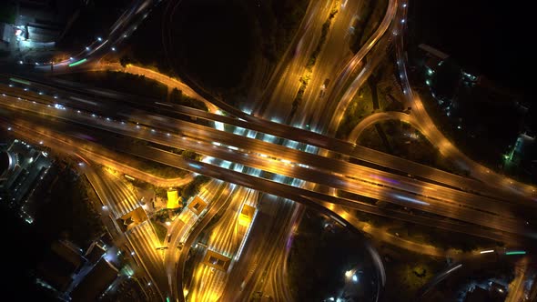 4K UHD : Aerial of drone flight over highway at night rush hour traffic