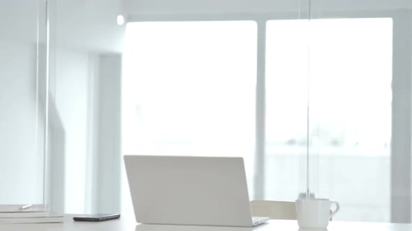 Pensive Middle Aged Businessman Thinking and Working on Laptop