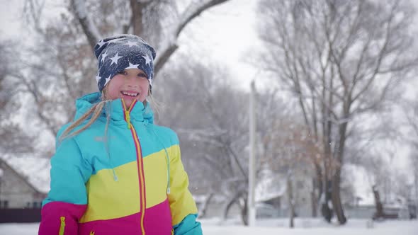 Funny Little Girl Having Fun in Beautiful Winter Park