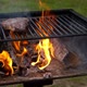 Man Cooking Meat Steaks on Professional Grill Outdoors on Natural Wood - VideoHive Item for Sale