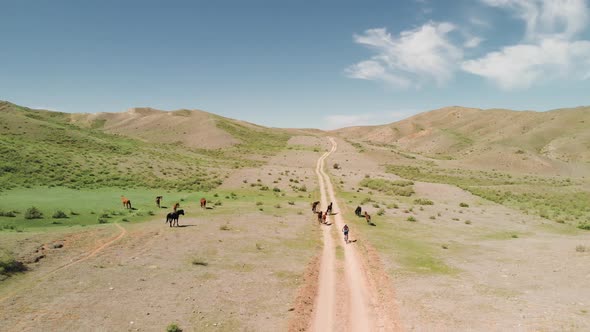 Drone Shot of Bicyclist Ride in the Mountains of Kazakhstan