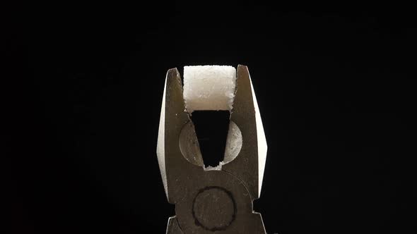 pliers crush sugar cube