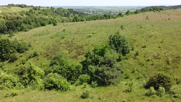 Aerial drone view of a flying over the rural agricultural landscape.