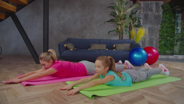 Active Sporty Fitness Family Exercising Indoors