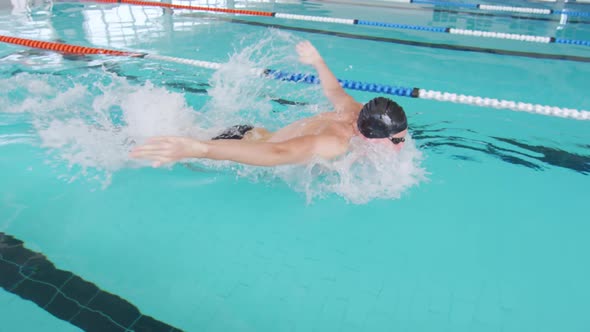 Swimmer swimming into the pool