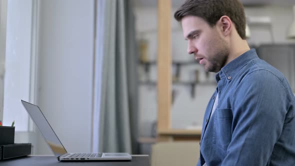 Beard Young Man Having Loss on Laptop