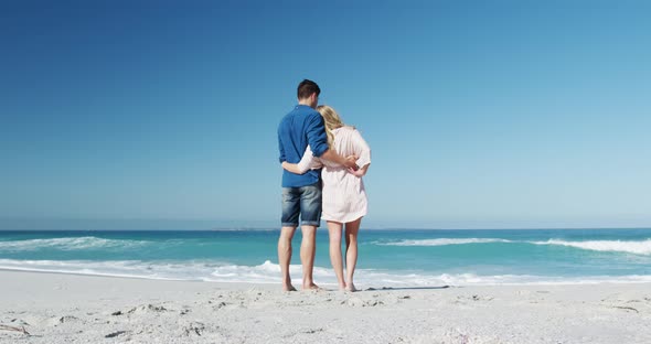 Couple in love enjoying free time on the beach together