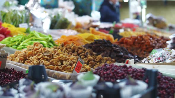 dried fruits and berries on the counter of the food market