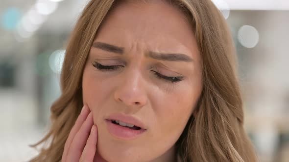 Close Up of Face of Woman Having Toothache