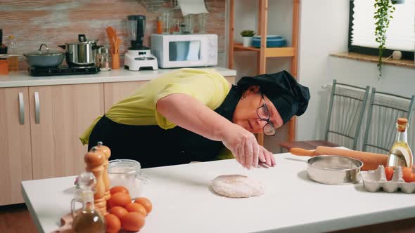 Floured Pizza Dough on Wooden Table