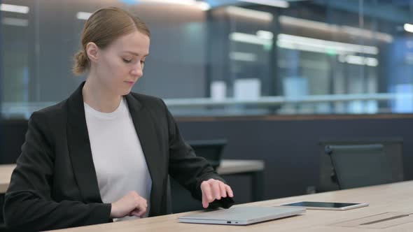 Woman Coming Back Opening Laptop in Office