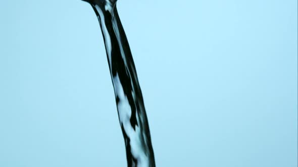 Water pouring and splashing in ultra slow motion 1500fps on a reflective surface - WATER POURS alt