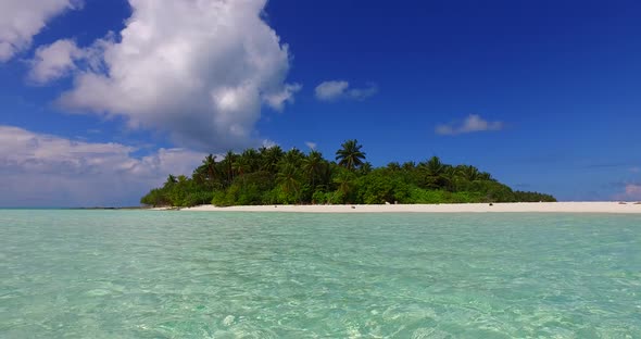 Natural flying copy space shot of a white sandy paradise beach and aqua blue water background in hig