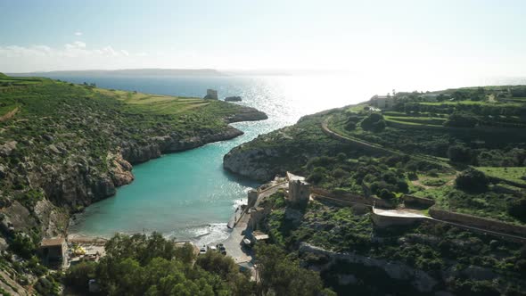 AERIAL: Magrr Ix-Xini Filled with Bright Sun Rays near Mediterranean Sea