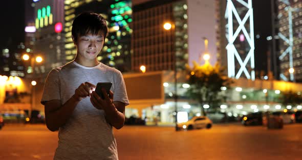 Man using mobile phone in evening 