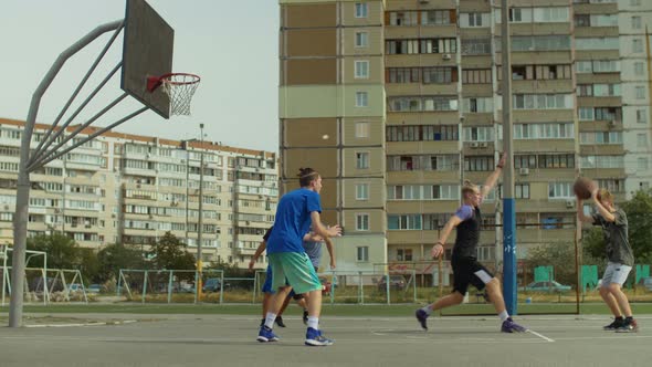 Handsome Streetball Player Doing Reverse Layup