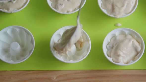 Filling Muffin Moulds with Dough