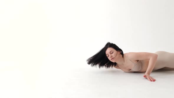 Woman in Beige Costume Dancing Contemp on White Background