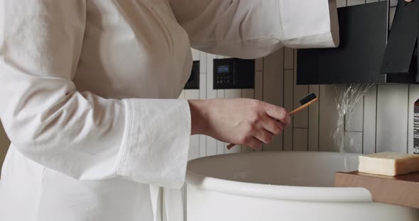 Woman's Hands Open a Modern Faucet with Sink Minimalist Interior Accessories