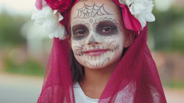 Happy Girl in Beautiful Halloween Costume Posing