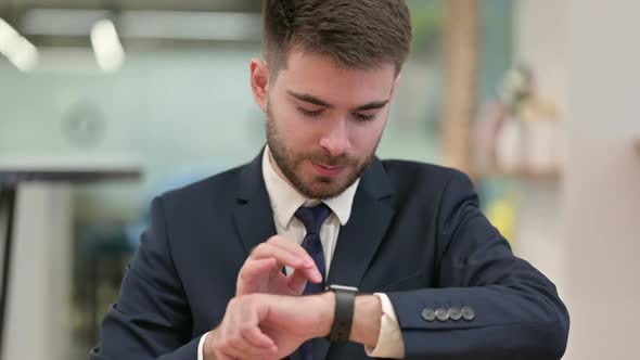 Young Businesswoman Using Smartwatch