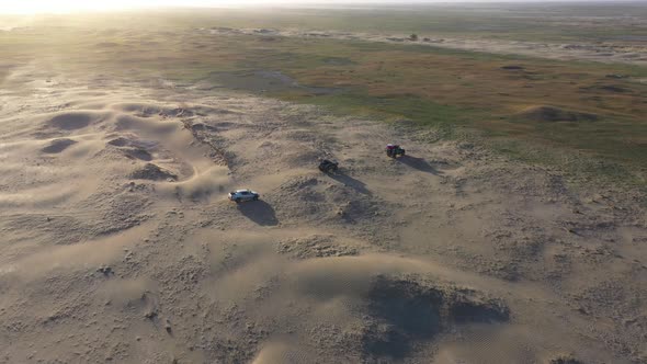 Desert Safari Offroading Group of Car 4X4 Vehicle Rides on Desert Dune Barkhan