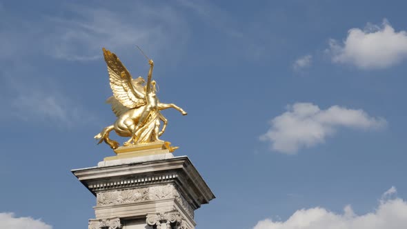 Famous Pont Alexandre III stone columns with golden statues slow tilt 4K 2160p 30fps UltraHD footage