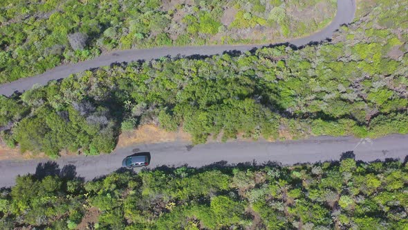 Car driving on a mountain road to a coastal town,Tenerife,Canary Islands,Spain.