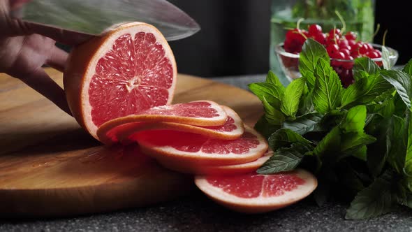 Slicing citrus fruit grapefruit