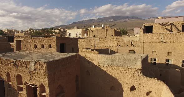 Clay and Stone Houses Within Desert Terrain.