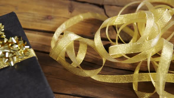 Christmas gift box and decoration on wooden table