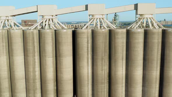 Aerial view of concrete grain silos revealing storage and shipping facility on shore of Lake Superio