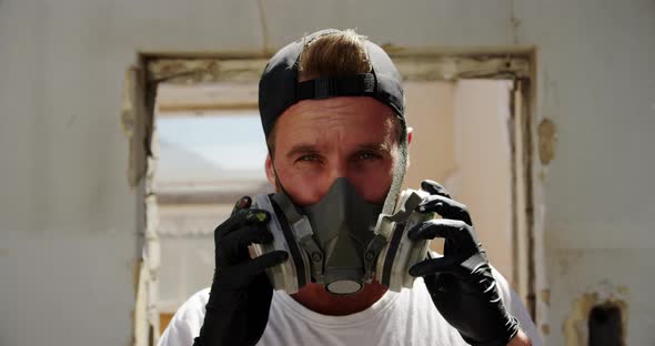Graffiti artist wearing protective mask 4k