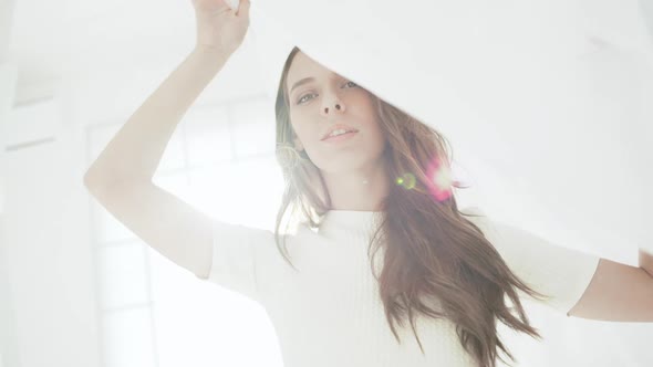 Young Beautiful Girl in White Decor