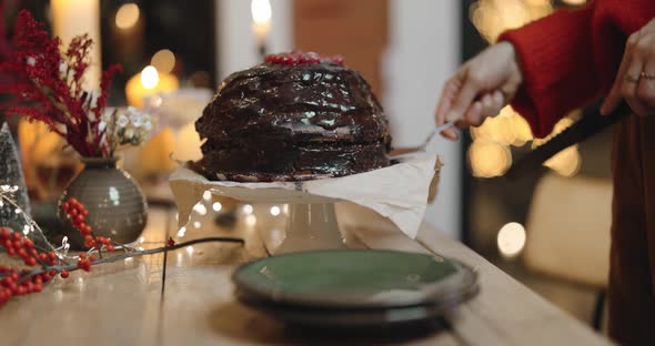 Cutting Festive Chocolate Pie During a Celebration