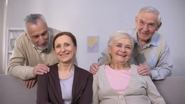 Senior Couples Hugging and Smiling at Camera, Family Portrait, Togetherness