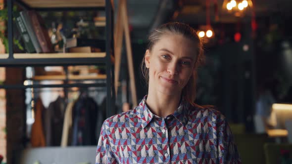 Portrait of Cute Young Girl Student in Cozy Cafe Smiling Looking at Camera