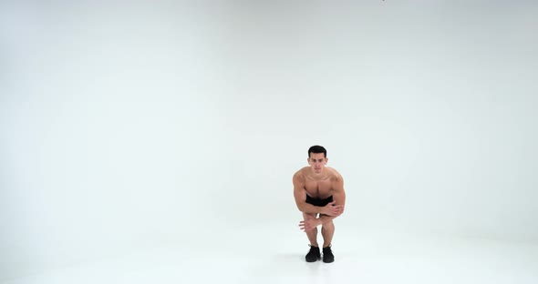 Shirtless Man Showing His Muscles in Slow Motion