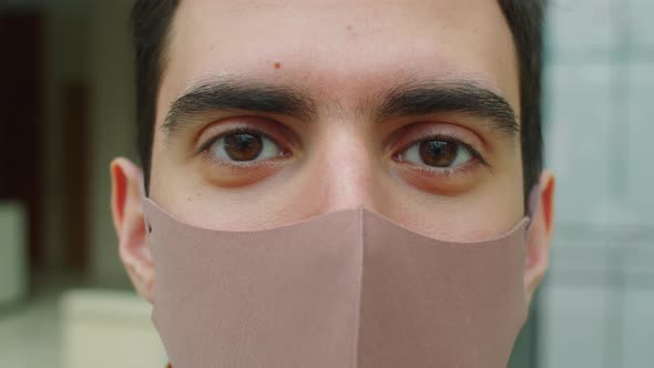 Portrait of Young Man in Protective Mask