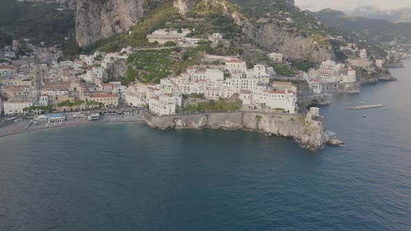 Aerial view of Amalfi, Italy. Picturesque hillside town on Mediterranean sea and rocky coastline, dr